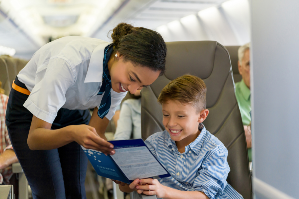 Flight Attendant assisting a young child
