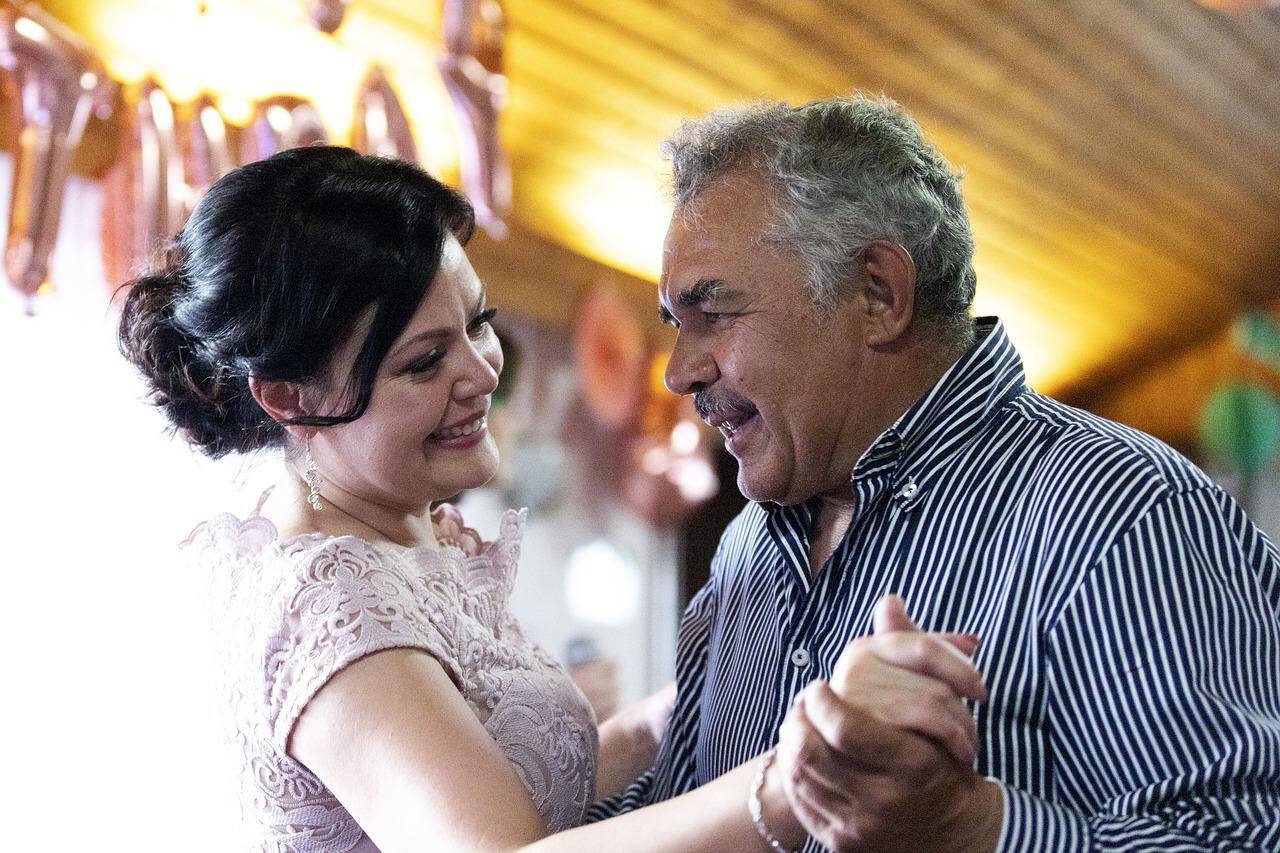 Happy retired couple dancing